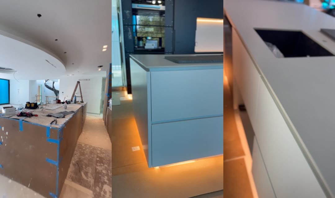 Three field views of the long kitchen during installation, from protected island to illuminated finished cabinetry.